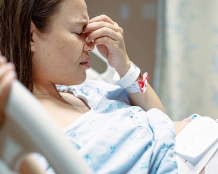 pregnant woman in hospital in labor Motherly