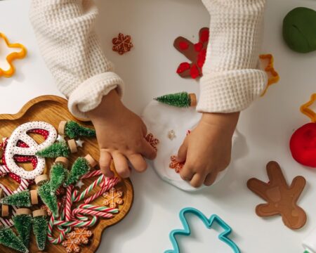 child hands doing christmas craft Motherly