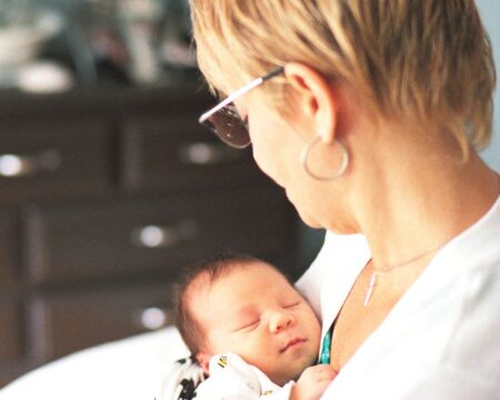 grandma holding baby Motherly