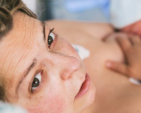 mother with newborn baby in the hospital Motherly