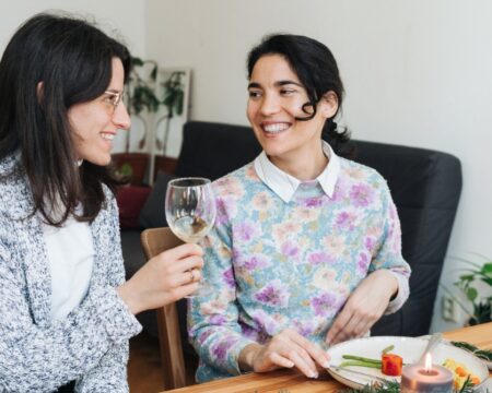 two women at holiday party Motherly