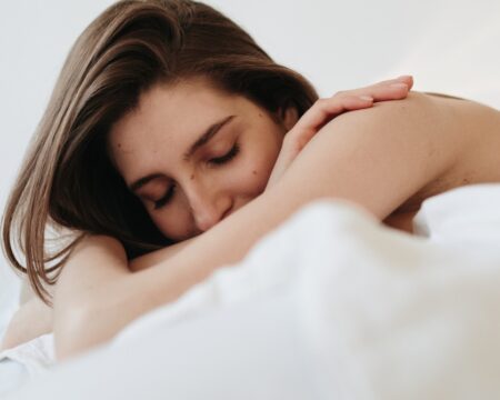 woman laying on bed Motherly