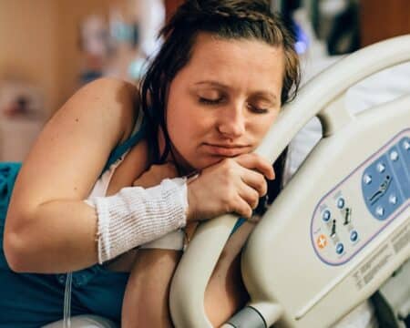 pregnant woman in labor in the hospital Motherly