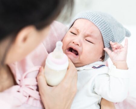 baby crying about bottle Motherly