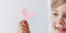 little girl holding paper heart Motherly