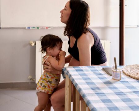 mom and frustrated toddler at home Motherly