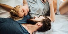 couple laying in bed together Motherly