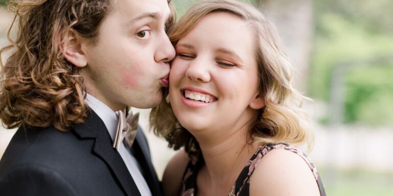 teen boy kissing the cheek of his prom date Motherly