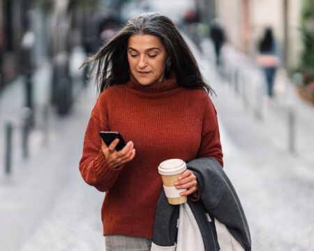 Middle Aged Woman Using Phone Motherly