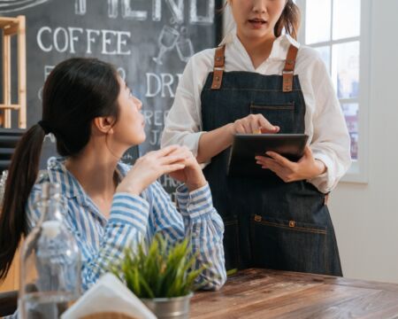 barista taking womans order Motherly