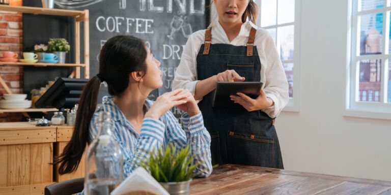 barista taking womans order Motherly