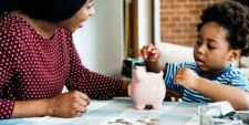 mom teaching son about saving money Motherly