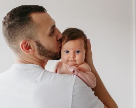 father kissing baby Motherly