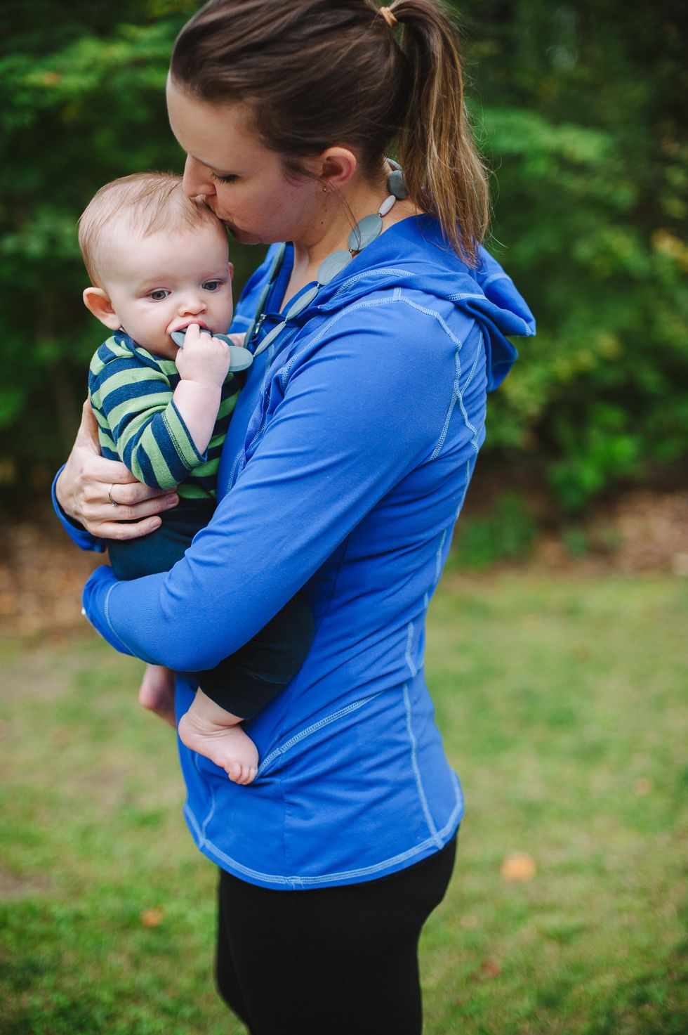 mom holding baby after recovering from her c-section. One mom shares what to expect during a c-section.