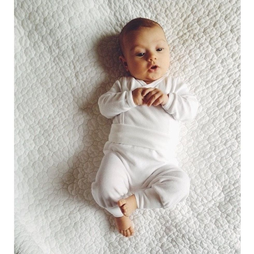 newborn-baby-awake-in-her-crib
