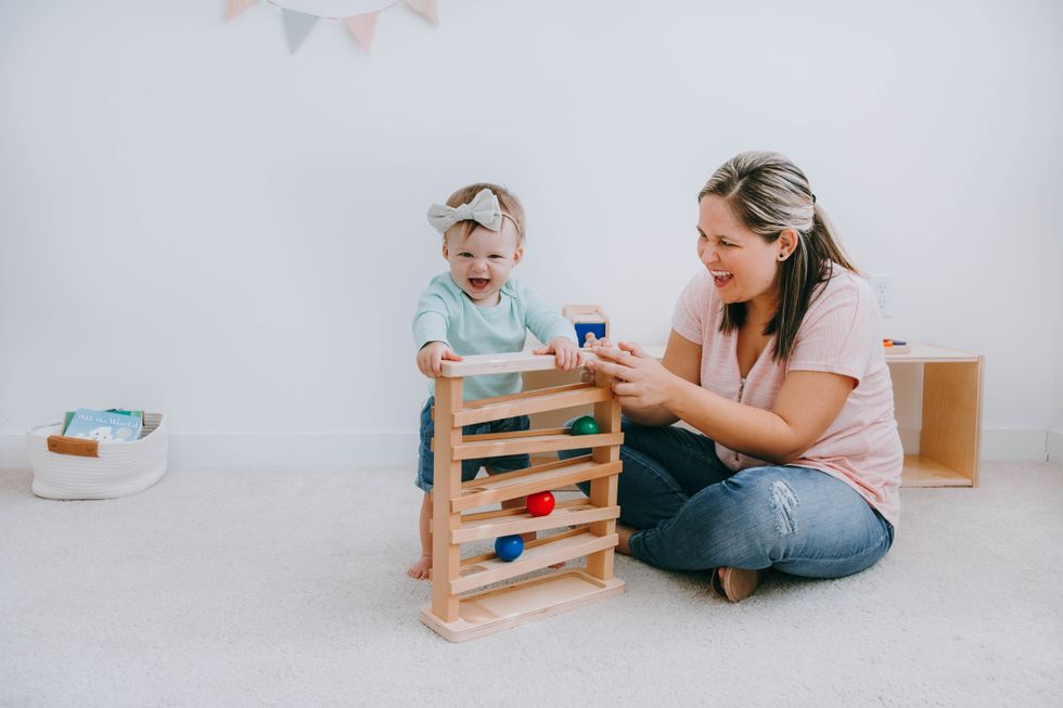 mother applying principles of montessori for babies by creating a development-centered nursery