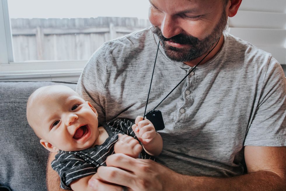 the one accessory all new dads need 0 Motherly