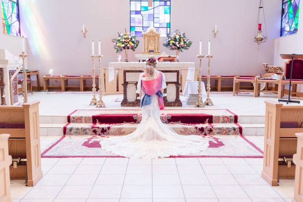 this bride wore her toddler on her wedding day 0 Motherly